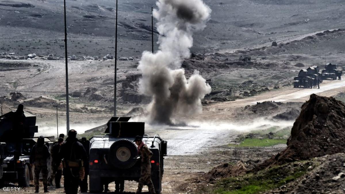 Iraqi troops blow up a mine on the outskirts of Mosul as Iraqi forces battle against Islamic State (IS) group jihadists to recapture the west of the city on February 28, 2017. Hundreds of civilians fled through the desert to escape fighting and privation in Mosul, joining thousands of others who left their homes as conditions worsen in the city's west. / AFP / ARIS MESSINIS (Photo credit should read ARIS MESSINIS/AFP/Getty Images)