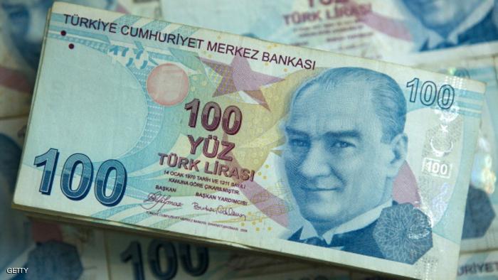 A pile of 100 denomination Turkish lira banknotes sit in this arranged photograph in Istanbul, Turkey, on Sunday, Jan. 5, 2014. The Turkish lira is poised to rebound after a corruption scandal engulfing Prime Minister Recep Tayyip Erdogan's government pushed the currency to its most oversold level in a decade. Photographer: Kerem Uzel/Bloomberg via Getty Images