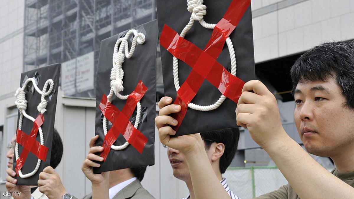 Members of Amnesty International hold a rally to protest against Japan's death penalty in front of the national Diet in Tokyo on July 28, 2009. Japan has hanged three inmates convicted of multiple murders including a Chinese national and a middle-aged man who found his victims through an Internet suicide site. The government identified the condemned as Hiroshi Maeue, 40, Yukio Yamaji, 25, and Chinese national Chen Detong, 41, who had killed three of his compatriots and wounded three more Chinese people. AFP PHOTO / Yoshikazu TSUNO (Photo credit should read YOSHIKAZU TSUNO/AFP/Getty Images)