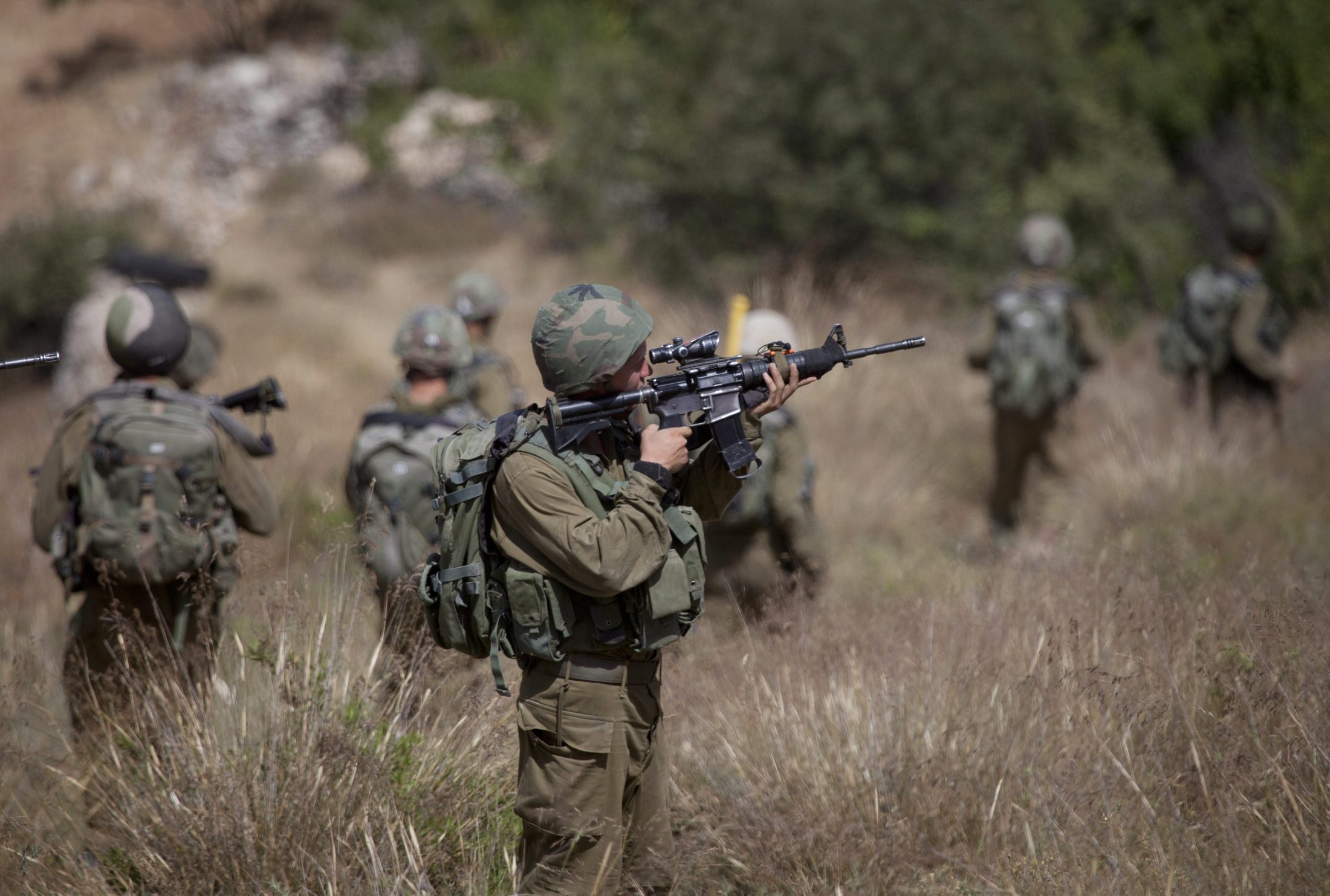 Israeli soldiers patrol as they search for three missing Israeli teens in the West Bank city of Hebron on Friday, June 20, 2014. The three Jewish seminary students disappeared June 12 while hitchhiking in the West Bank. Israel has blamed the Islamic militant Hamas group for the apparent abduction, but has offered no proof. Hamas has praised the abduction of the teenagers but has not claimed responsibility for it. (AP Photo/Majdi Mohammed)