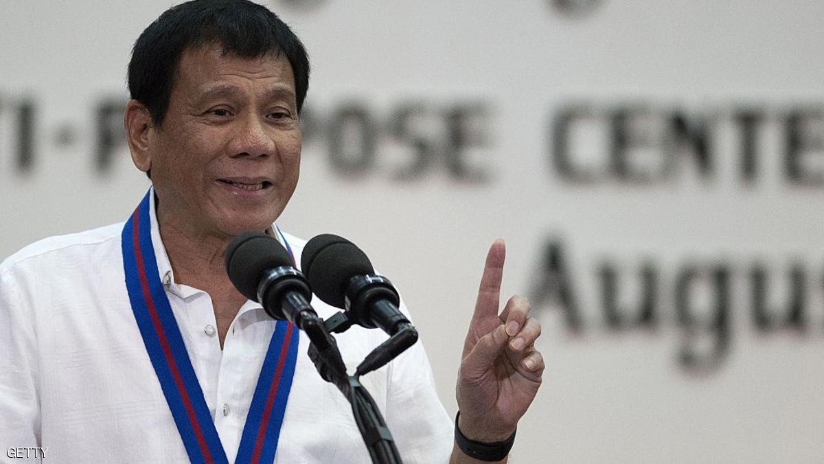 Philippine President, Rodrigo Duterte gestures as he speaks during the 115th Police Service Anniversary at the Philippine National Police (PNP) headquarters in Manila on August 17, 2016. Philippine President Rodrigo Duterte lashed out at the United Nations for criticising the growing number of killings under his anti-drug campaign, warning foreign human rights probers against coming to his country. / AFP / AFP POOL / NOEL CELIS (Photo credit should read NOEL CELIS/AFP/Getty Images)