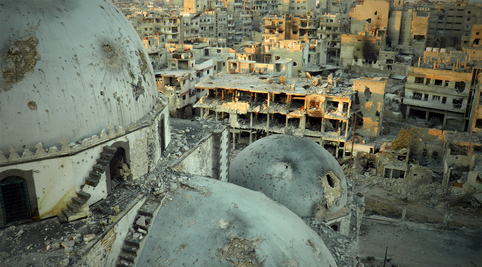 TOPSHOTS A handout image released by the Syrian opposition's Shaam News Network on July 25, 2013, allegedly shows the Khaled bin Walid mosque whose mausoleum has been partially destroyed in the al-Khalidiyah neighbourhood of the central Syrian city of Homs. Syrian army shelling destroyed the centuries-old mausoleum a monitoring group and activists said on July 22. Reports of the destruction of the Sunni Muslim pilgrimage site emerged as an intense army campaign to reclaim rebel-held areas of Homs, a strategic junction city, entered its fourth week. AFP PHOTO/HO/SHAAM NEWS NETWORK == RESTRICTED TO EDITORIAL USE - MANDATORY CREDIT "AFP PHOTO / HO / SHAAM NEWS NETWORK" - NO MARKETING NO ADVERTISING CAMPAIGNS - DISTRIBUTED AS A SERVICE TO CLIENTS - AFP IS USING PICTURES FROM ALTERNATIVE SOURCES AS IT WAS NOT AUTHORISED TO COVER THIS EVENT, THEREFORE IT IS NOT RESPONSIBLE FOR ANY DIGITAL ALTERATIONS TO THE PICTURE'S EDITORIAL CONTENT, DATE AND LOCATION WHICH CANNOT BE INDEPENDENTLY VERIFIED ==