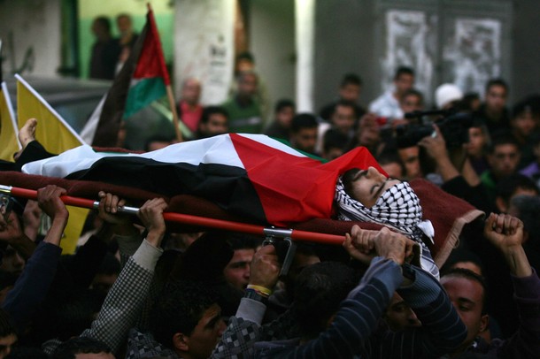 Mourners carry the body of Palestinian Salem Samoudi, 24, during his funeral in the village of Yamun, after he was shot dead by Israeli soldiers at he Dotan checkpoint in the northern West Bank on January 20, 2011.AFP PHOTO/SAIF DAHLAH (Photo credit should read SAIF DAHLAH/AFP/Getty Images)