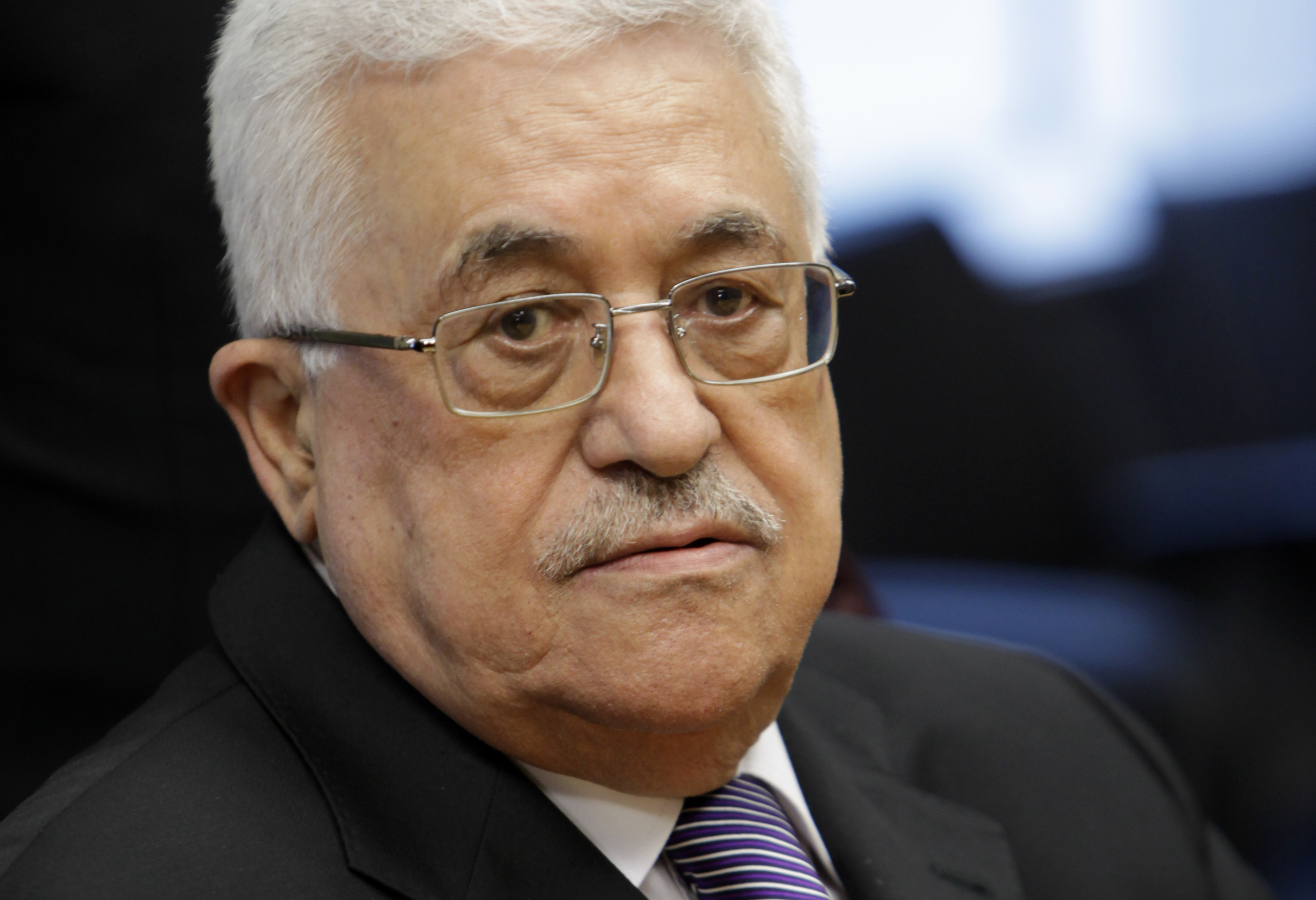 Palestinian President Mahmoud Abbas sits down after giving a letter requesting recognition of Palestine as a state to Secretary-General Ban Ki-moon during the 66th session of the General Assembly at United Nations headquarters Friday, Sept. 23, 2011. (AP Photo/Seth Wenig)