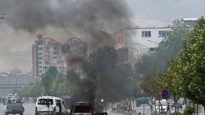 Smoke and flames rise from burning vehicles at the site of an attack in front of the Afghan Parliament building in Kabul on June 22, 2015. Taliban militants attacked the Afghan parliament on June 22, with gunfire and explosions rocking the building, sending lawmakers running for cover in chaotic scenes relayed live on television.The insurgents tried to storm the complex after triggering a car bomb but were repelled and have taken position in a partially-constructed building nearby, officials said about the ongoing attack. All MPs were safely evacuated after the attack, which came as the Afghan president's nominee for the crucial post of defence minister was to be introduced in parliament. AFP PHOTO / SHAH Marai (Photo credit should read SHAH MARAI/AFP/Getty Images)