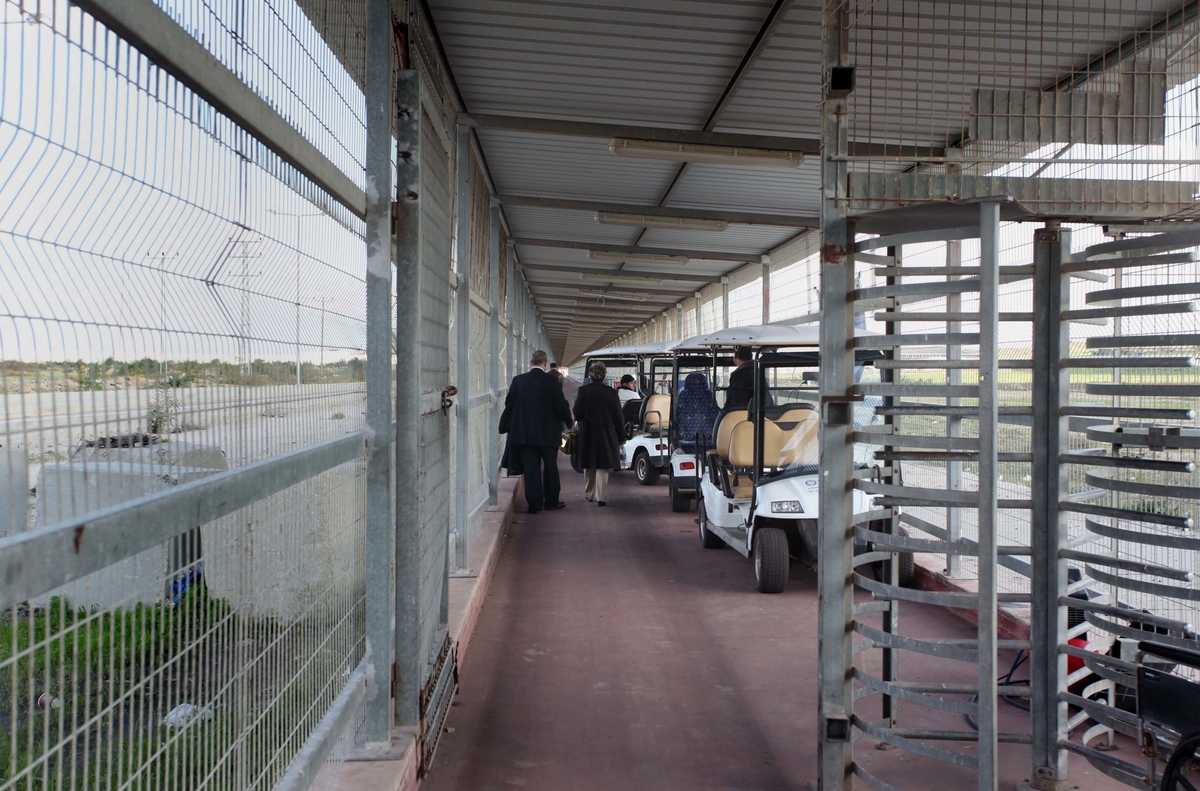 Palestinian Christian families leave Gaza to enter Israel through the Erez border crossing between Israel and northern Gaza Strip to attend Christmas in the West Bank town of Bethlehem, on December 24, 2014. This year, Israel granted around 500 permits to Palestinian Christians, allowing them to travel from Gaza to the West Bank so they can visit Bethlehem's Nativity church and attend the traditional midnight mass. Photo by Ashraf Amra