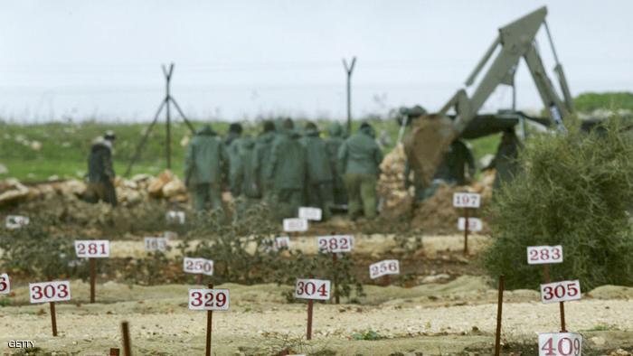 AMIAD, ISRAEL - JANUARY 26: Graves are marked with numbers as Israeli soldiers exhume the body of one of 59 Lebanese from the army's Enemy Graveyard January 26, 2004 near Kibbutz Amiad in northern Israel. In addition to the bodies, Israel will release 435 Arab prisoners - 400 Palestinians, 23 Lebanese and 12 nationals of other countries - and one German, in exchange for the return of businessman Elhanan Tennenbaum and the bodies of three slain soldiers - Benny Avraham, Adi Avitan and Omar Suwad. (Photo by David Silverman/Getty Images)