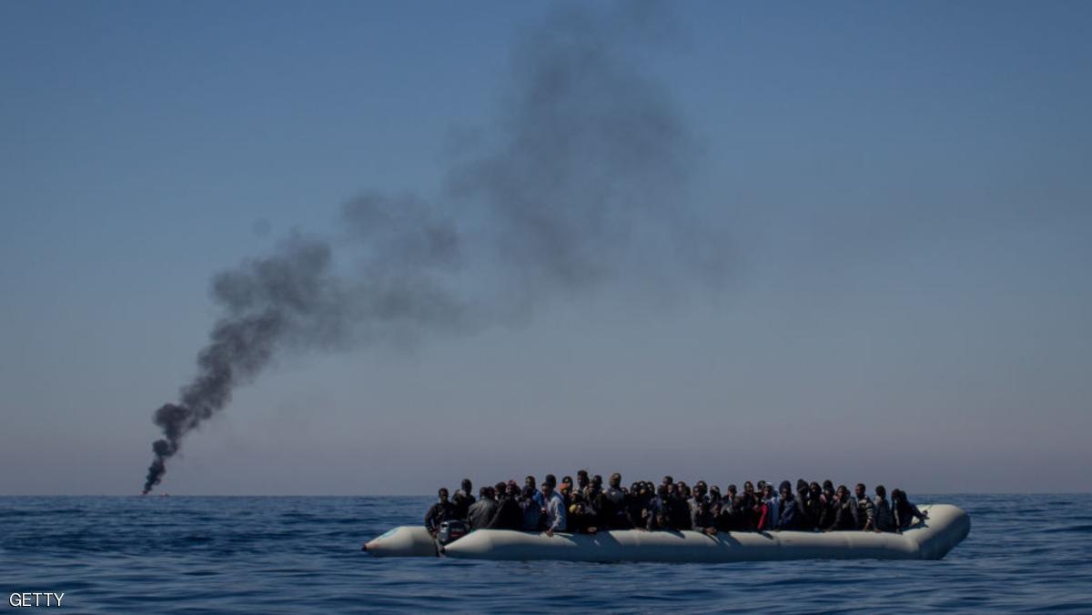 LAMPEDUSA, ITALY - MAY 18: Refugees and migrants wait to be rescued from an overcrowded boat by crew members from the Migrant Offshore Aid Station (MOAS) Phoenix vessel on May 18, 2017 off Lampedusa, Italy. Numbers of refugees and migrants attempting the dangerous central Mediterranean crossing from Libya to Italy has risen since the same time last year with more than 43,000 people recorded so far in 2017. MOAS is a Malta based NGO dedicated to providing professional search-and-rescue assistance to refugees and migrants in distress at sea. Since the start of the year MOAS have rescued and assisted 3214 people and are currently patrolling and running rescue operations in international waters off the coast of Libya. (Photo by Chris McGrath/Getty Images)