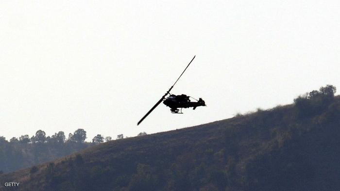 SIRNAK, TURKEY - OCTOBER 30: A Turkish military Cobra helicopter flies over Cudi mountain on October 30, 2007 near the Iraqi border in the southeastern province of Sirnak, Turkey. The Turkish military continued its bombardment of Kurdish rebel positions near the Iraqi border on Tuesday. Despite international opposition, the Turkish government has not ruled out crossing the Iraqi border to target PKK camps there. (Photo by Burak Kara/Getty Images)